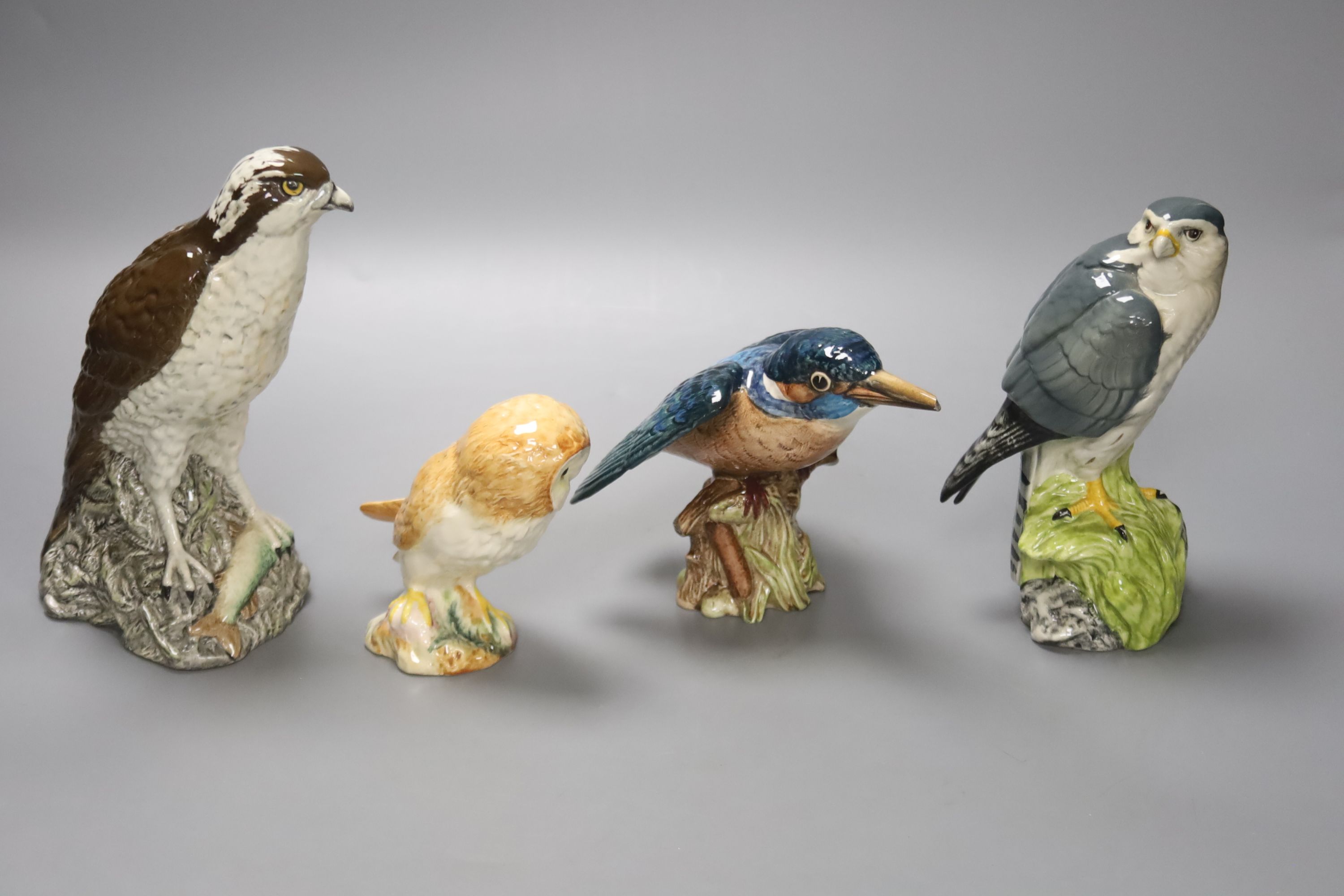 Three Beswick bird figures, a Royal Doulton Whyte & Mackay Scotch Whisky 'Merlin' figure, together with a large Wedgwood jasperware type bowl with silver plated collar